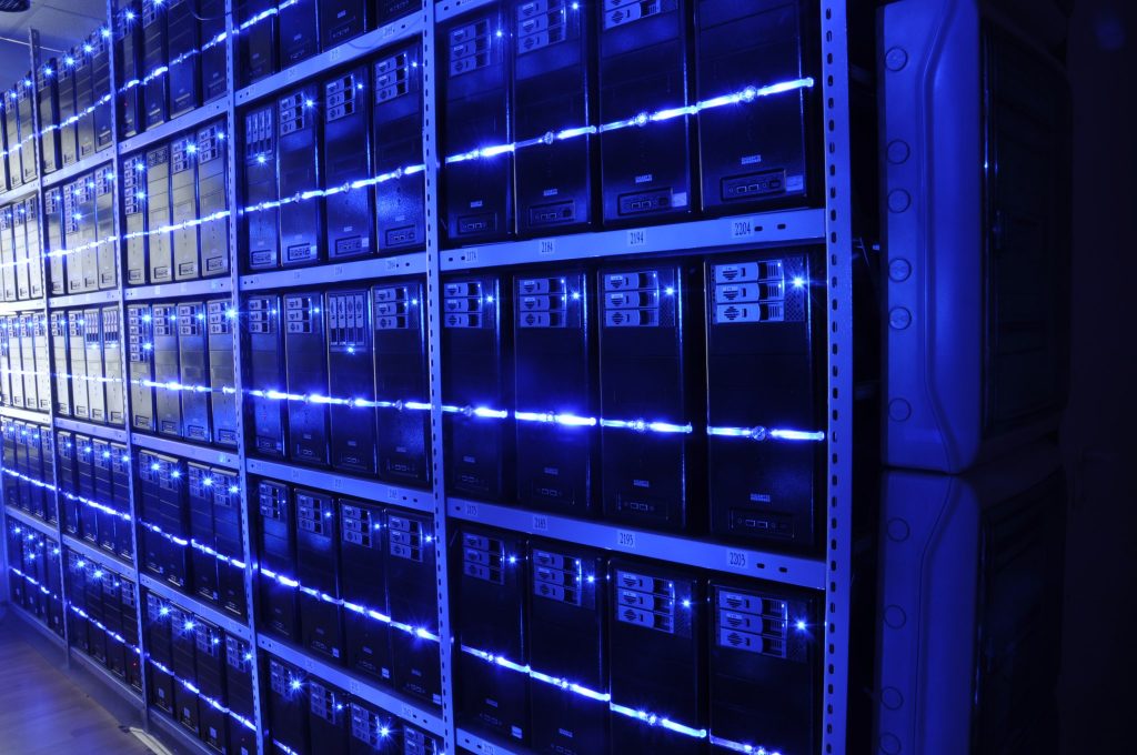 Rows of servers in a data center, illustrating where CRM AI agents store and process customer data across regions.
