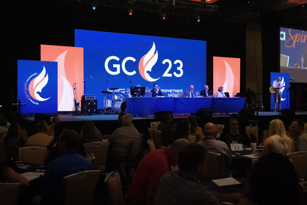 Professionals in a business meeting discussing a services engagement, illustrating the sales-to-delivery handoff in a professional services CRM workflow